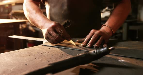 Mid-section of welder working