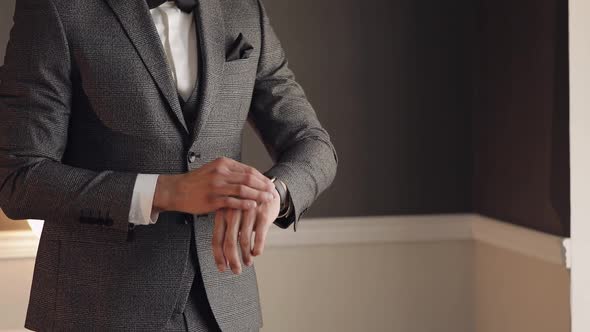 Handsome Stylish Groom Man Looking on Wrist Watch at Home Gets Ready Before Date Meeting with Bride