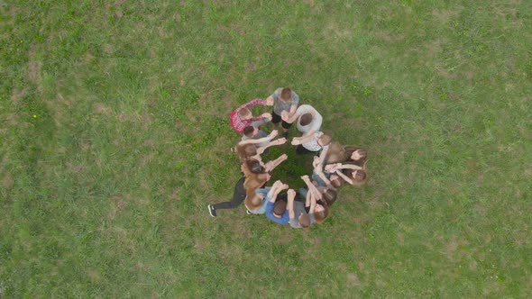 Friendly Friends Join Hands Together. Aerial View.