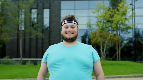 Closeup Portrait of a Obese Man Standing and