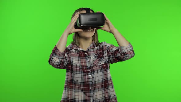 Woman Using VR Headset Helmet To Play Game, Dance. Watching Virtual Reality 3d Video. Chroma Key