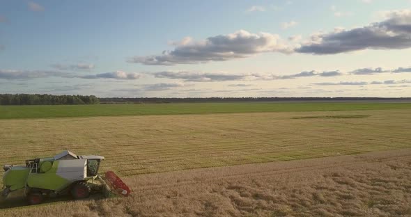 Aerial View Combine with Platform Harvests Cereal in Field