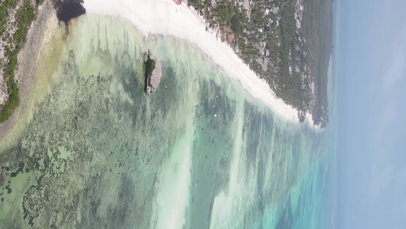 Vertical Video of the Ocean Near the Coast of Zanzibar Tanzania Aerial View