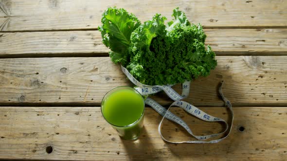 Green tea with leafy vegetable and measuring tape 4k