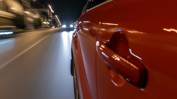 Drivelapse From Side of Car Moving on a Night Avenue in City Timelapse Hyperlapse