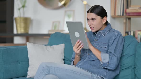 Loss Latin Woman Reacting to Failure on Sofa