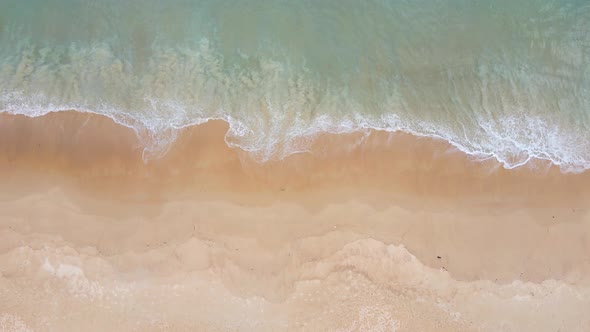 Nature video 4K Aerial view of drone. Scene of top view beach and seawater on sandy beach in summer.