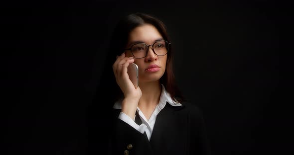 Business Woman is Glad to Hear Good News on Her Smartphone