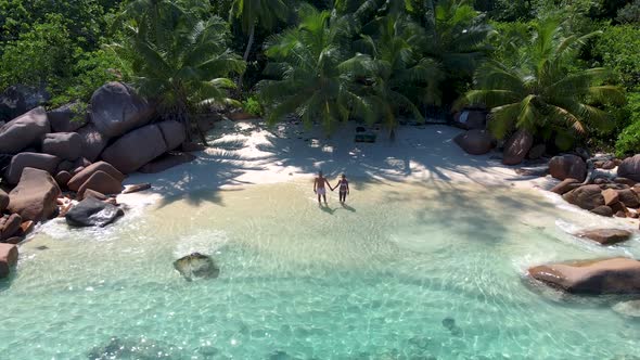 Praslin Seychelles Tropical Island with Withe Beaches and Palm Trees Couple Men and Women Mid Age on