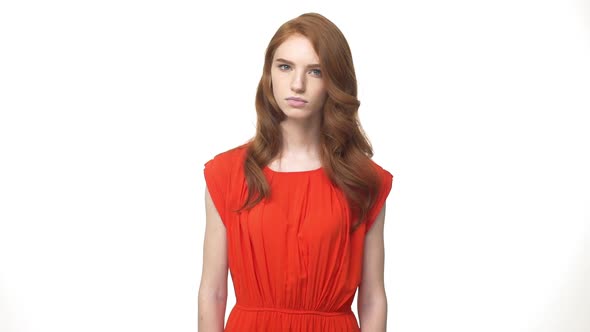 Young Beautiful Caucasian Woman in Gorgeous Orange Dress Standing and Say No Isolated Over White