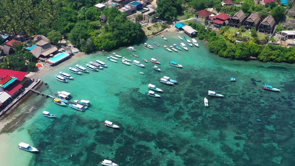 Coast and fishing boat as a background from top view. Turquoise water background from top drone.