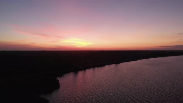 Drone Aerial View of Dark Seascape with Dramatic Sky Dolly Side Panning Over Paradise Beach Sunset