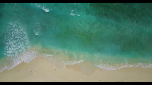Aerial drone view tourism of tropical seashore beach holiday by turquoise ocean with white sandy bac