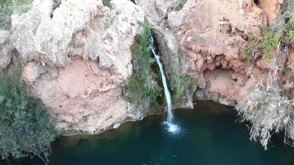 Small waterfall of Pego do Inferno in Santo Estêvão, in Tavira, Algarve, Portugal - Static Aerial