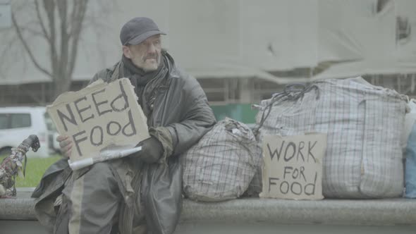 The Inscription "Need Food" By a Poor Homeless Tramp. Kyiv. Ukraine