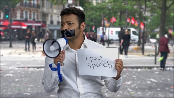 Portrait of Male Protester with Taped Mouth