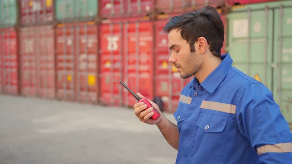 Two engineer male and female worker dockers in checking examine discussion