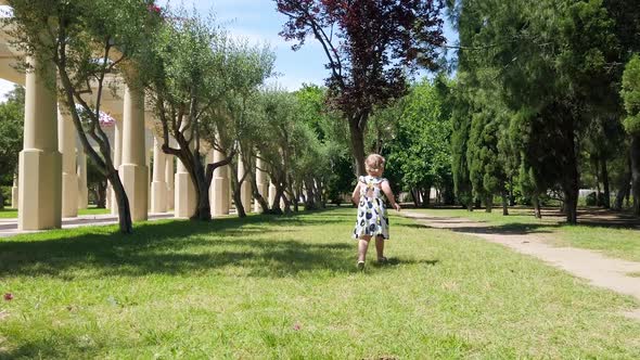 The girl runs for a soap bubble