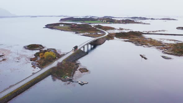 Truck Crossing Bridge at Atlantic Ocean Road In Norway. - Aerial Zoom Out