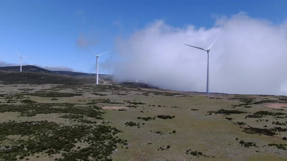 Aerial shot of the wind turbines in the clouds, Madeira, Portugal