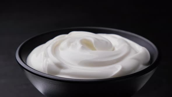 Bowl of Sour Cream on Black Background Greek Yogurt