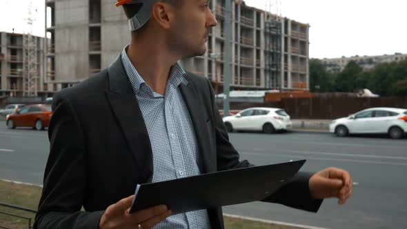 Architect Standing and Looking at His Project