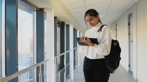 Pakistani Woman Student with a Tablet in the University