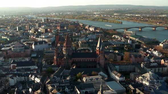 perfect drone circle shot around the red Cathedral of Mainz the city of Biontech with the Rhine rive