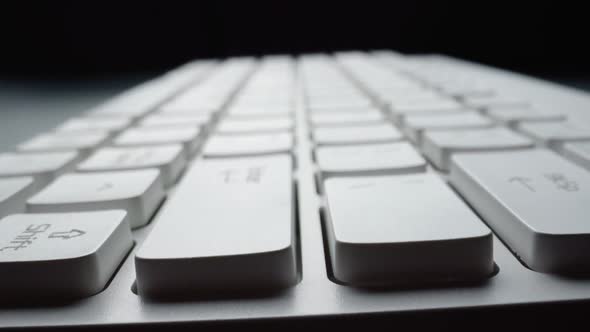 Close-up view of computer keyboard. Macro soft focus dolly shot