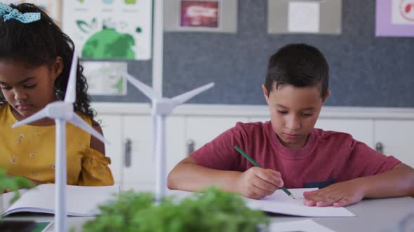 Diverse schoolchildren, learning about wind power and renewable sources of energy