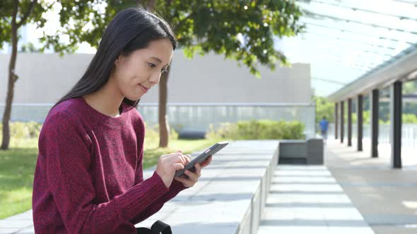 Woman using mobile phone at outdoor 