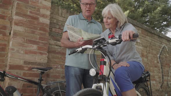 Senior couple planning bike tour
