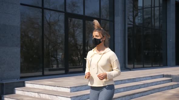 Portrait of Beautiful Young and Fit Woman Running and Jogging Alone in Business City Center Area