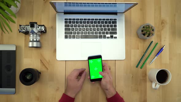 Man Using Phone With Green Screen, Working At Table Flat Lay