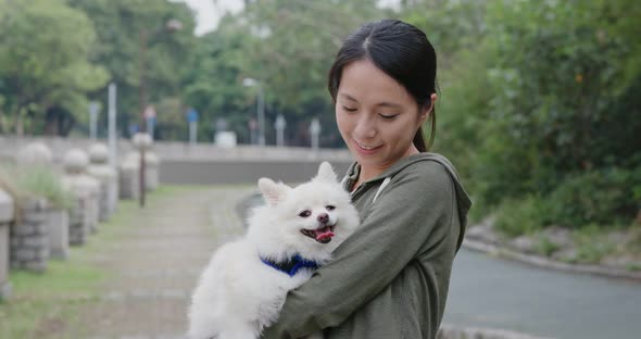 Woman with her Pomeranian dog