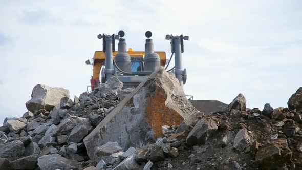 Bulldozer Move the Stones on Camera