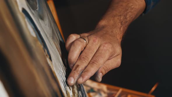 Painter Using His Hands To Create Oil Painting Masterpiece