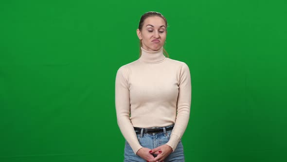 Portrait of Dissatisfied Young Woman Showing Thumb Down Shaking Head No