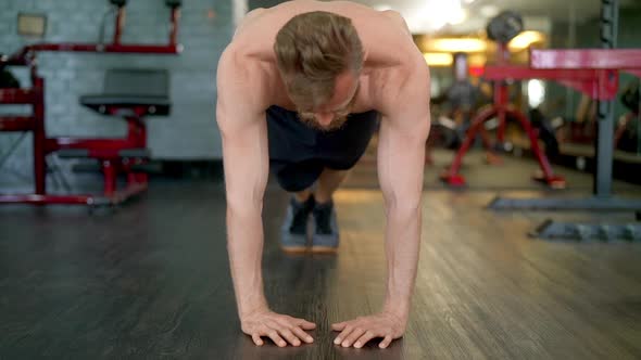 Handsome Male Athlete Doing a Full Diamond Push Up