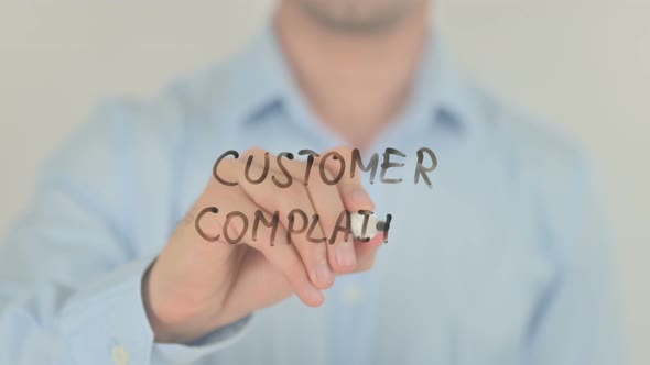 Customer Complaints, Man Writing on Transparent Screen