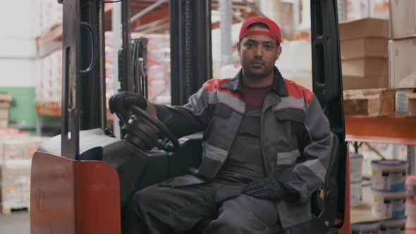 Workman In Forklift Machine