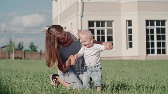 Loving Mother Playing with Son Outdoors alt