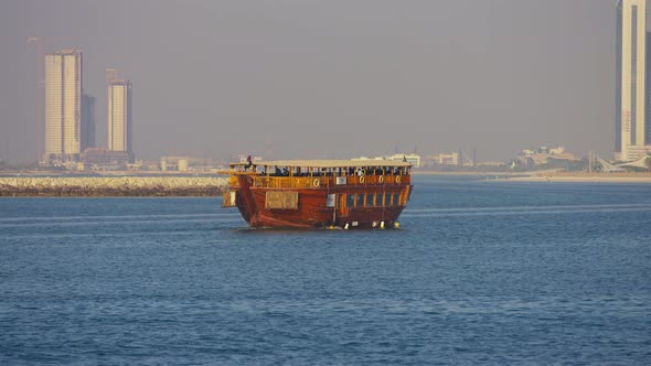 Wooden boat sailing in Abu Dhabi alt
