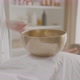 Masseuse Conducts Session of Sound Therapy with Singing Bowl on Back of Client - VideoHive Item for Sale