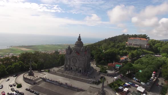 Beautiful Catholic Church with the Picturesque Nature on the Background