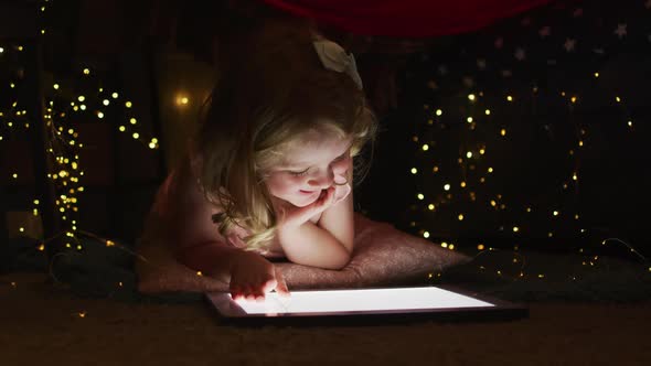 Caucasian mother and daughter having fun using digital tablet