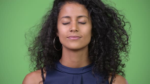 Young Beautiful Hispanic Businesswoman Relaxing