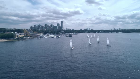 Breathtaking Bird's Eye View of Yachts Racing on the River Towards the Camera