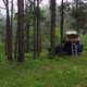 A Car Roof Top Tent for Camping on the Roof Rack of an Offroad Car in a Forest on a Misty Cloudy - VideoHive Item for Sale