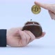 Male Hand Puts a Cryptocoin Bitcoin or BTC in a Small Brown Wallet Depicting Earning or Paying with - VideoHive Item for Sale